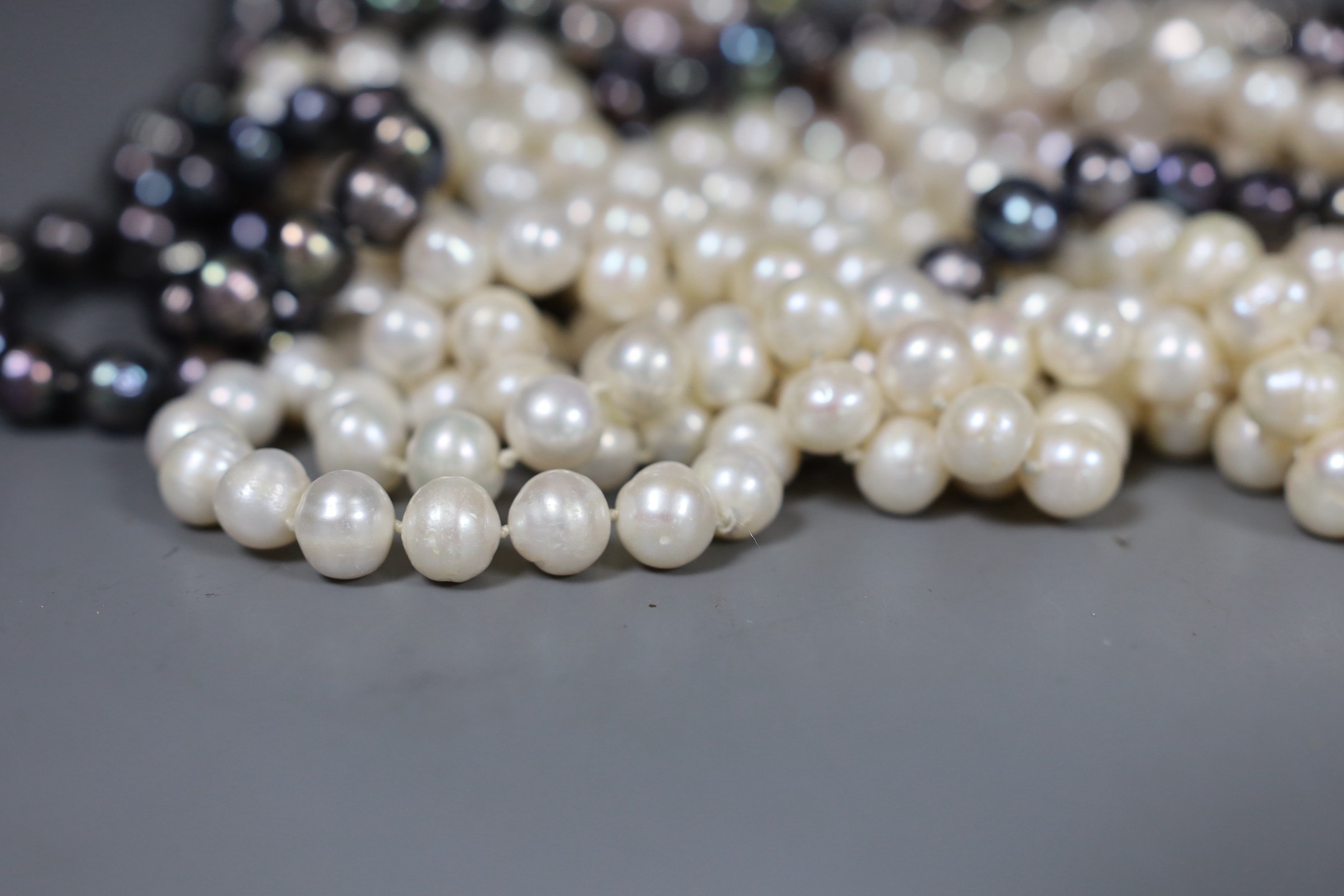 Thirteen assorted modern freshwater pearl necklaces, longest 116cm.